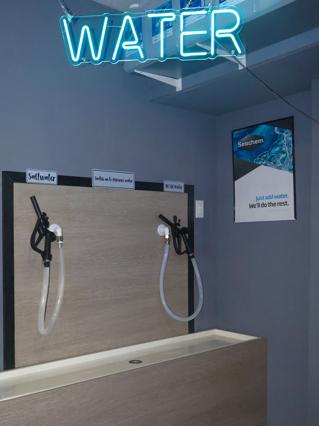 The self-service Water Station at Barrier Reef, with the saltwater and RO/DI dispensers above the fill basin